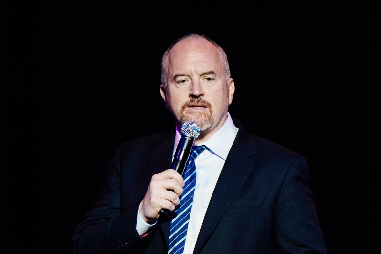 Louis C.K. performing onstage.